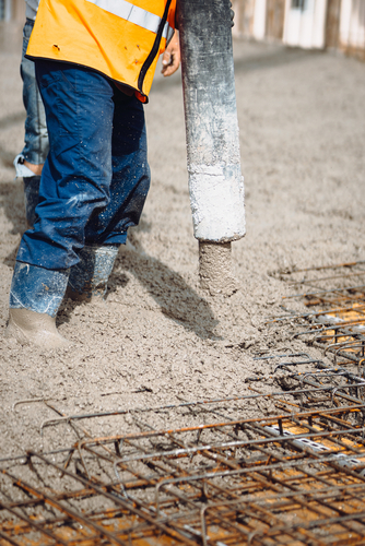 Details,Of,Construction,Site.,Worker,Pouring,Concrete,With,Automatic,Pump